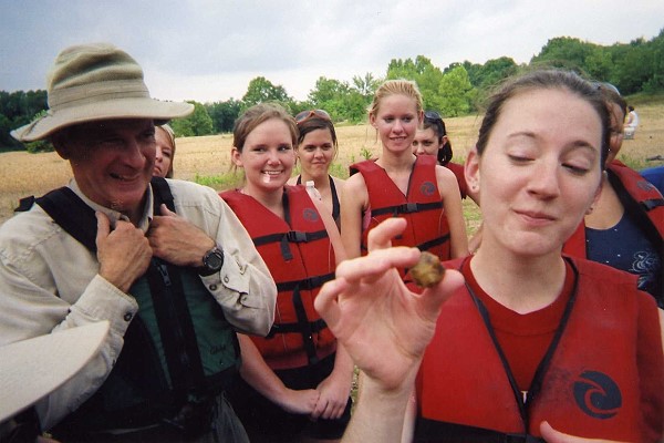 Susan Guider admires a 3 knobbed warty back muscle.  Dr. David Potts, Judson College President enjoys the moment