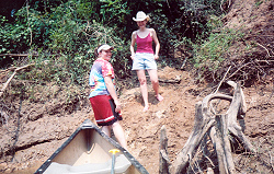 Ricki and Valerie prepare to pull the canoe up the ditch