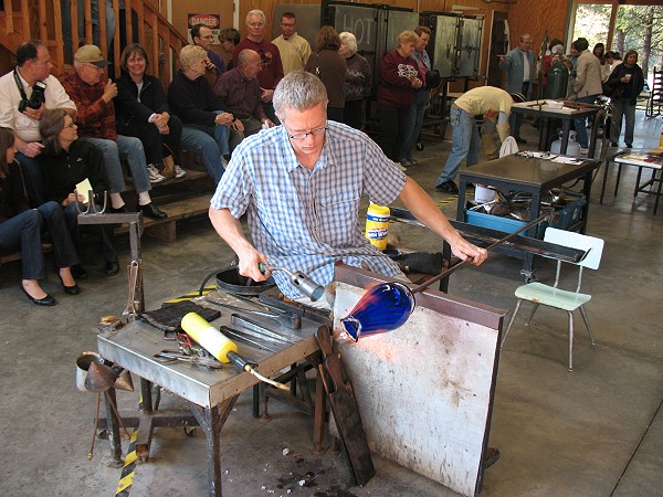 Cal Breed shaping a cobalt Roxy vase