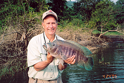 Ray Wilson with trophy male rainbow bass from Lake Arenal