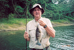 Thomas Wilson with a female rainbow bass