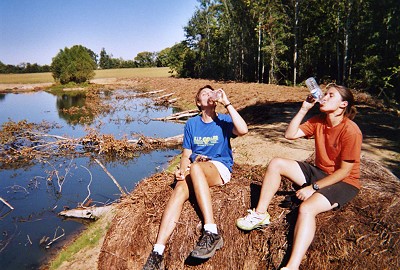 Angi Gullard and Stacy Lawton help Dr. Wilson with a lake construction project