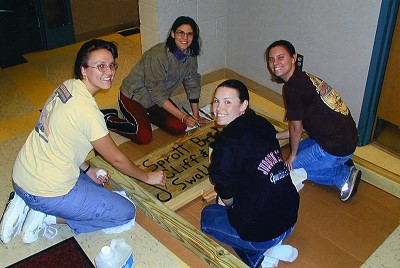 Earth Team making a sign