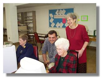 Mrs. John Wilbourne and Mrs. Nat Davis learn about the Internet with Instructor Brad Thompson