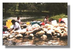 Mayans washing clothes in Mopan River