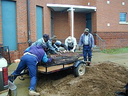 Workers unload stones