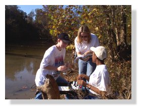 Charmyne Hall, Jennifer Goolsby and Aundrea Threadford work with the water testing kit